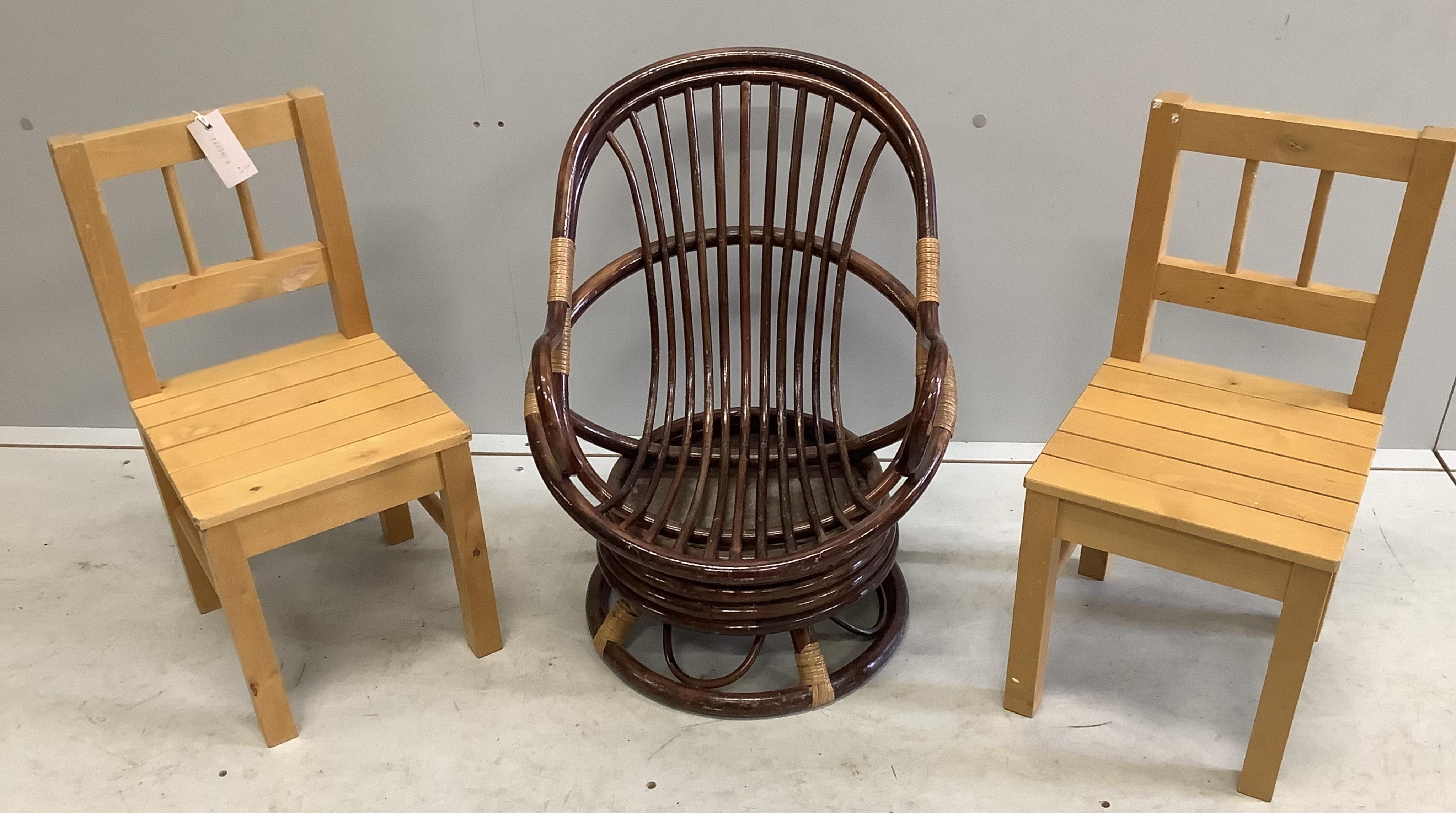 A pair of beech child's chairs together with a bamboo swivel child's chair, largest width 45cm, height 56cm. Condition - fair